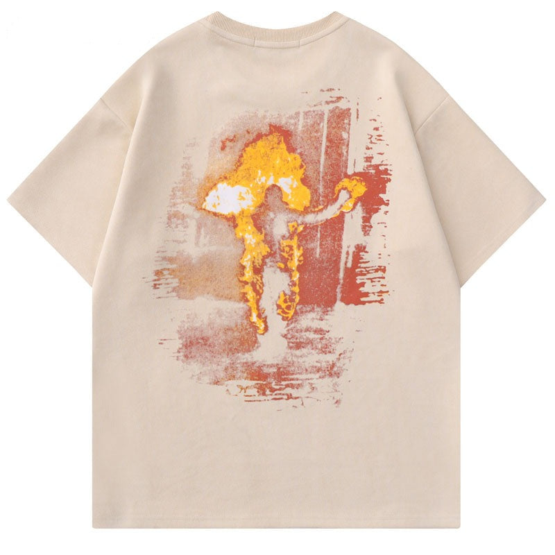 beige t-shirt with a man running on fire